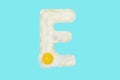 The letter E from a fried egg Royalty Free Stock Photo