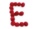 letter E made from raspberries. isolated on white background for birthday party