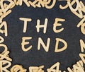 Letter `The end` composed of wooden letters.