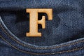 Letter F of the alphabet - blue jeans texture background. Top view Royalty Free Stock Photo