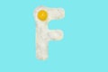 The letter F from a fried egg Royalty Free Stock Photo