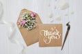 Letter with flowers and calligraphic pen greeting card for St. Valentine`s Day in rustic style with calligraphic text Royalty Free Stock Photo