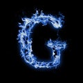 Letter G. Blue fire flames on black Royalty Free Stock Photo