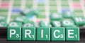 Letter green scrabble is spelling word PRICE.