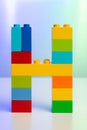 the letter H built from toy brick letters Royalty Free Stock Photo