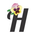 The letter H is decorated with single colorful garden pansy flower