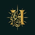 Letter H. Glowing Golden Monogram. Bright Star with Rays. Elegant Calligraphic Logo. Creative Art Design. Luxury Template for Bran Royalty Free Stock Photo