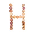 The letter `H` is made of wine corks. Isolated on white background Royalty Free Stock Photo