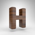Letter H uppercase on white background. Dark oak 3D letter with brown wood texture. Royalty Free Stock Photo