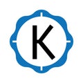 The letter K is black in color with a blue frame with a petal motif Royalty Free Stock Photo