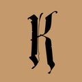 Letter K, in the Gothic style. Vector. Alphabet. The symbol is isolated on a golden background. Calligraphy and lettering.