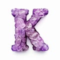 letter K made of translucent purple stone on white background generative AI