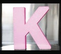 Letter K in pink colour