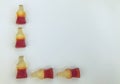 The letter l from marmalade in the form of bottles with lemonade. creative letter. gummy words. unusual inscription. delicious and