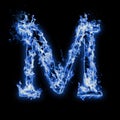 Letter M. Blue fire flames on black Royalty Free Stock Photo