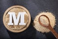 Letter M, Organic maca powder - Lepidium meyenii. Text space Royalty Free Stock Photo