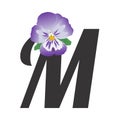 The letter M with a single purple pansy flower