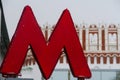 Letter M subway symbol on the background of the Kremlin