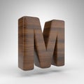 Letter M uppercase on white background. Dark oak 3D letter with brown wood texture. Royalty Free Stock Photo