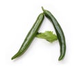 Letter A made from green chili peppers and salad alphabetic ABC letters