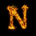 Letter N. Fire flames on black isolated background