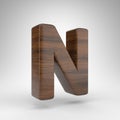 Letter N uppercase on white background. Dark oak 3D letter with brown wood texture. Royalty Free Stock Photo