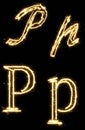 Letter P. Alphabet made by sparkler. Isolated on a black background. Royalty Free Stock Photo
