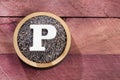 Letter P - Organic poppy seeds. Papaver somniferum. Text space Royalty Free Stock Photo