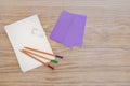 Letter paper, pencils and envelopes.