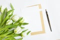 Letter, pen and bouquet on white background. Invitation cards, or love letter with white tulips. Top view, flat lay Royalty Free Stock Photo