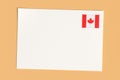 Letter Or Postcard From Canada: Blank White Card with Canadian Flag Postage Stamp, 3d Illustration