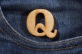 Letter Q of the alphabet - blue jeans texture background. Top view Royalty Free Stock Photo