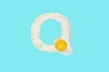 The letter Q from a fried egg Royalty Free Stock Photo