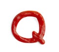 Letter Q written with ketchup on white background Royalty Free Stock Photo