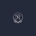 Letter R Decorative Crown Ring Alphabet Logo isolated on Navy Blue Background. Luxury Silver Initial Abjad Logo Design Template.