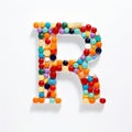 Whimsical Pill Letter R: Detailed Shapes And Vibrant Colors