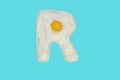 The letter R from a fried egg Royalty Free Stock Photo