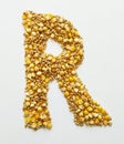 letter r of the alphabet is made of wheat and corn grains