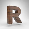 Letter R uppercase on white background. Dark oak 3D letter with brown wood texture. Royalty Free Stock Photo