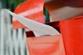 Letter in red mail box on home fence Royalty Free Stock Photo