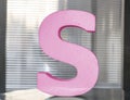 Letter S in pink colour