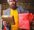 Letter for santa claus. Man mature bearded with eyeglasses received post for santa. Gifts delivery service. Post for