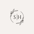 Letter SH wedding monogram logo design with simple natural circle leaf frame Royalty Free Stock Photo