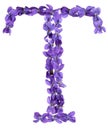 Letter T from alphabet, from flowers of violet, isolated on white background