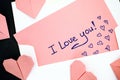 Letter with text I Love You! with envelope and pink origami hear