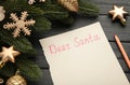 Letter to Santa Claus with Christmas decoration on black background. Inscription Dear Santa Royalty Free Stock Photo