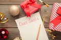 Letter to Santa Claus with Christmas decoration on grey wooden background. Inscription Dear Santa Royalty Free Stock Photo