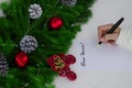 Letter to Santa Claus. Christmas decorations and paper with place for greeting. Royalty Free Stock Photo