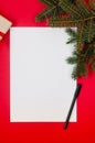 Letter to Santa Claus. Christmas and New Year holiday card with empty paper sheet on red background Royalty Free Stock Photo