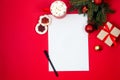 Letter to Santa Claus. Christmas and New Year holiday card with empty paper sheet on red background Royalty Free Stock Photo